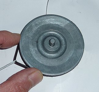 The drive belt fitted with a trapped piece of cord