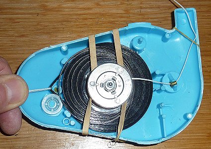 Pull the belt cord loop to fit the speed governor